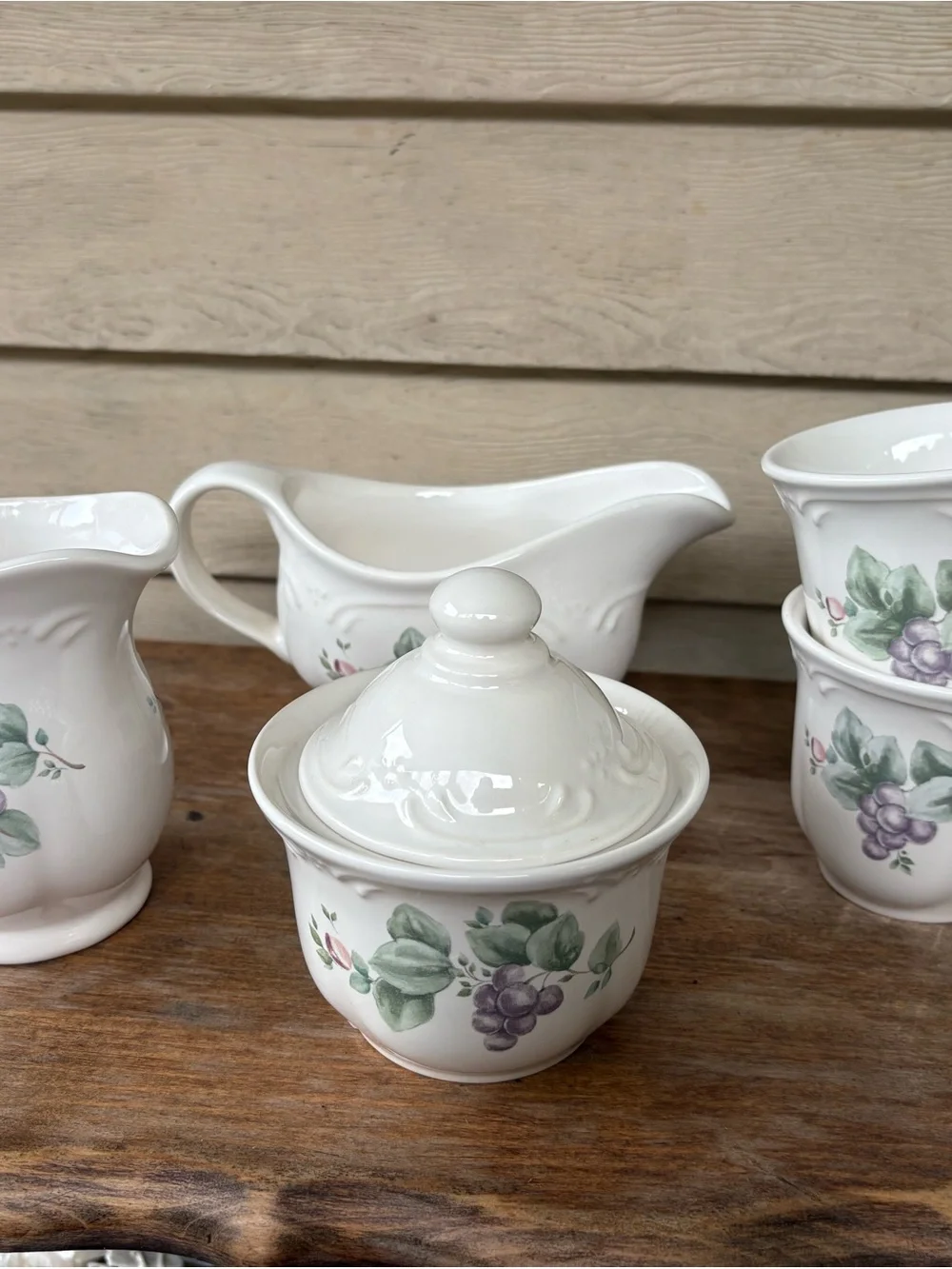 Set of Pfaltzgraff Grapevine stoneware: creamer, sugar bowl, gravy boat, 2 cups